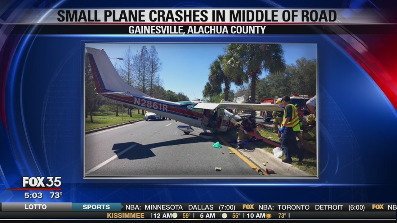 Small plane crashes in middle of road
