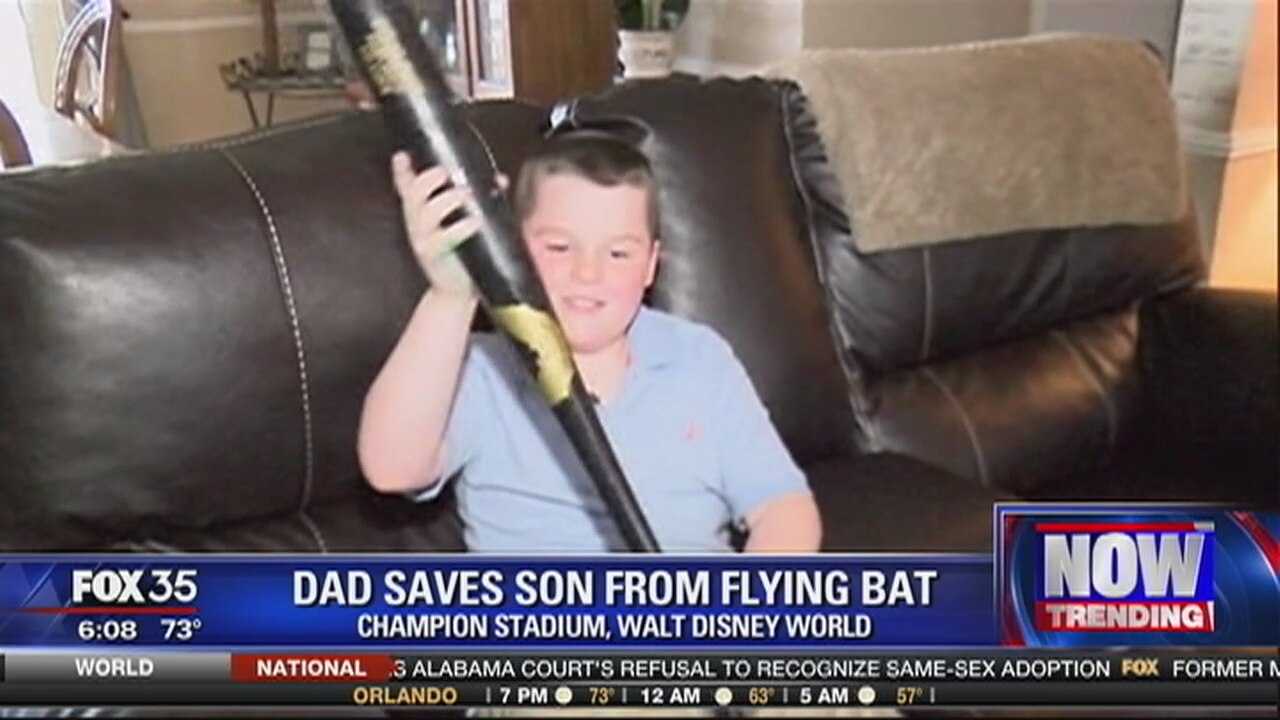 Dad saves son from flying bat