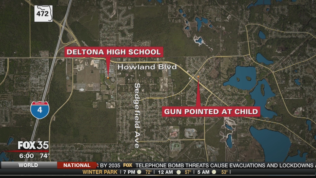 Deputies say armed robber pointed gun at child