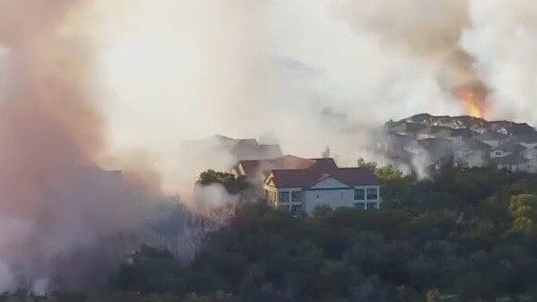Apartment building destroyed, residents evacuated amid raging grass fire