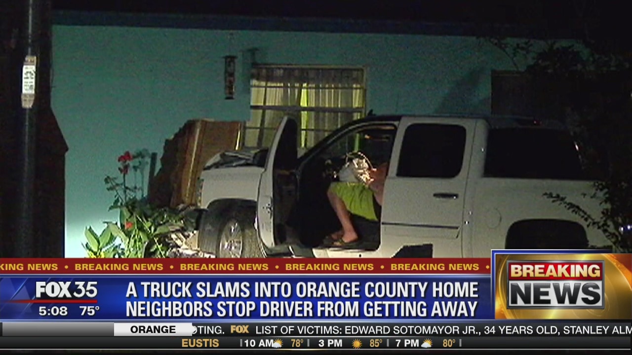 Truck slams into home