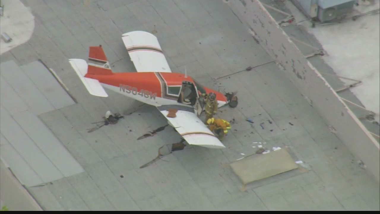 Small plane crash lands on roof in Pomona