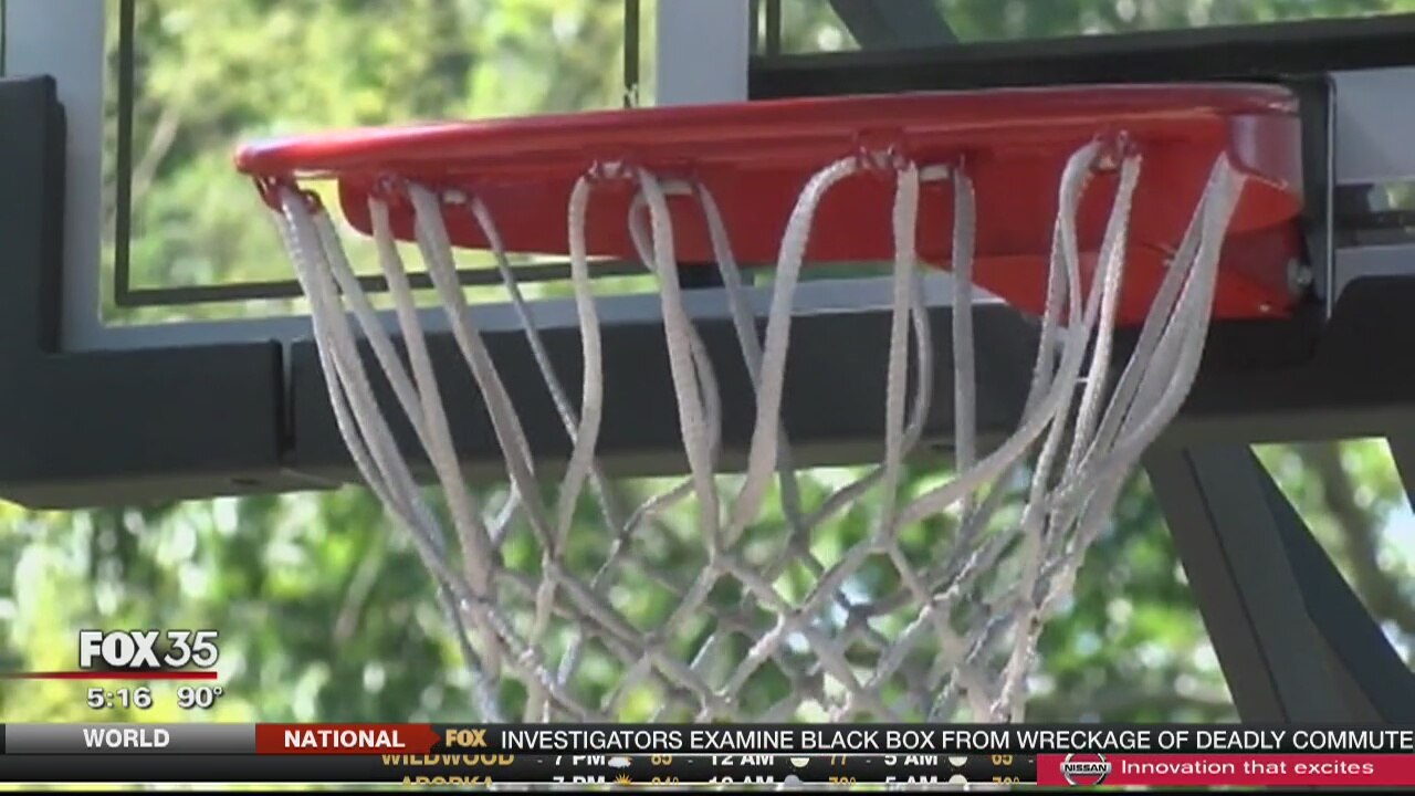 'Basketball cop' surprises students with hoop, basketballs