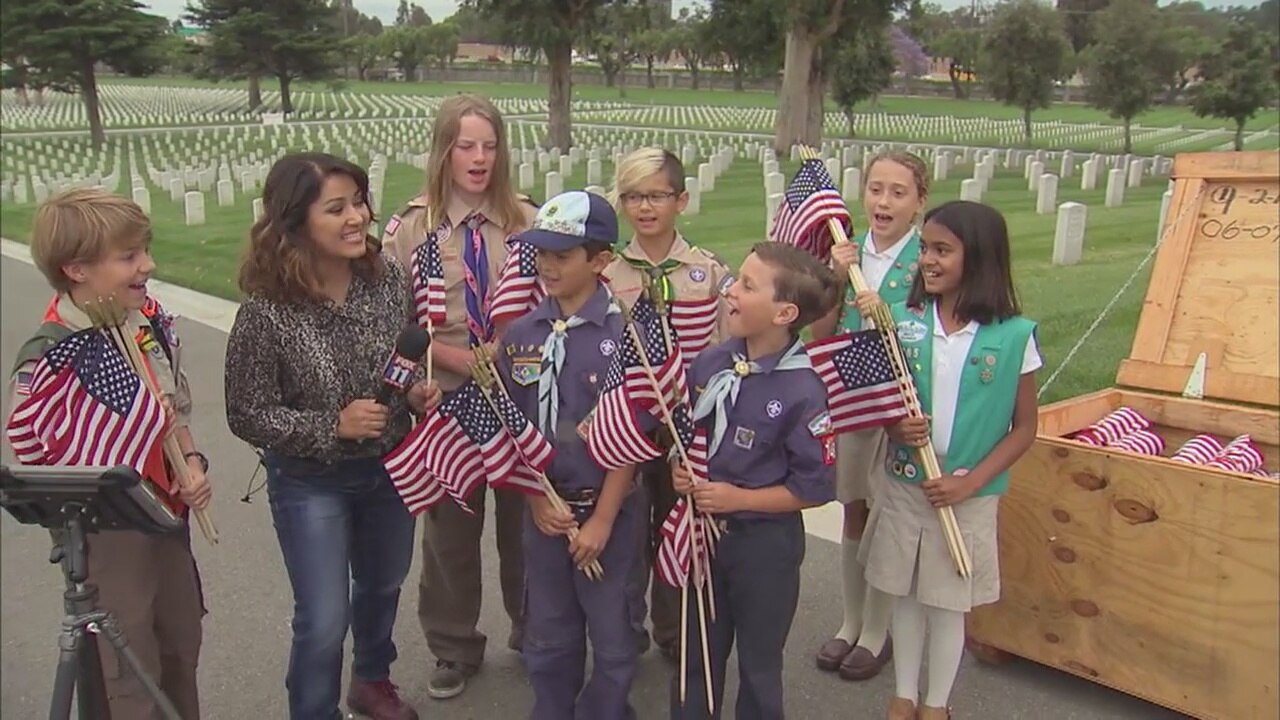 Boy and Girl Scouts seek help placing flags for Memorial Day