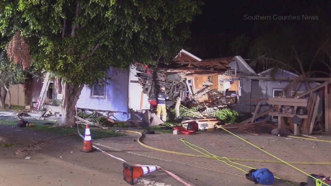 Pickup truck crashes upside down on a home