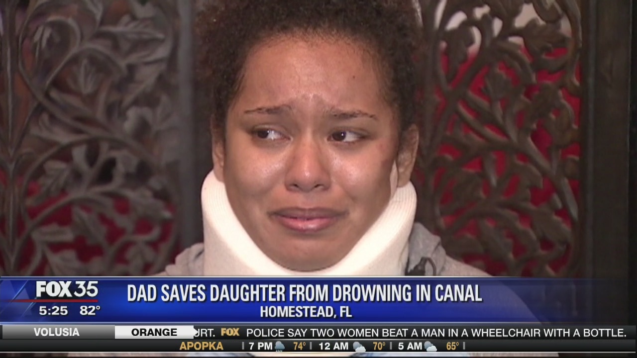 Dad saves daughter from drowning in car