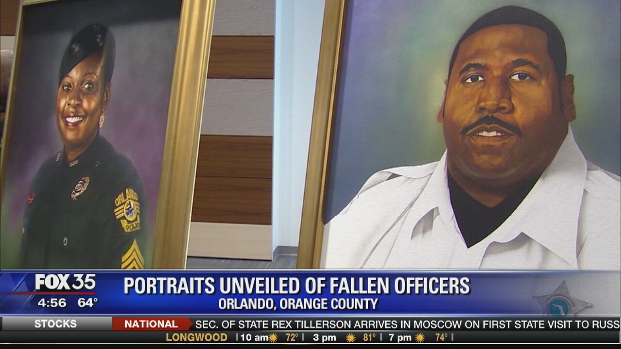 Portraits unveiled of fallen officers