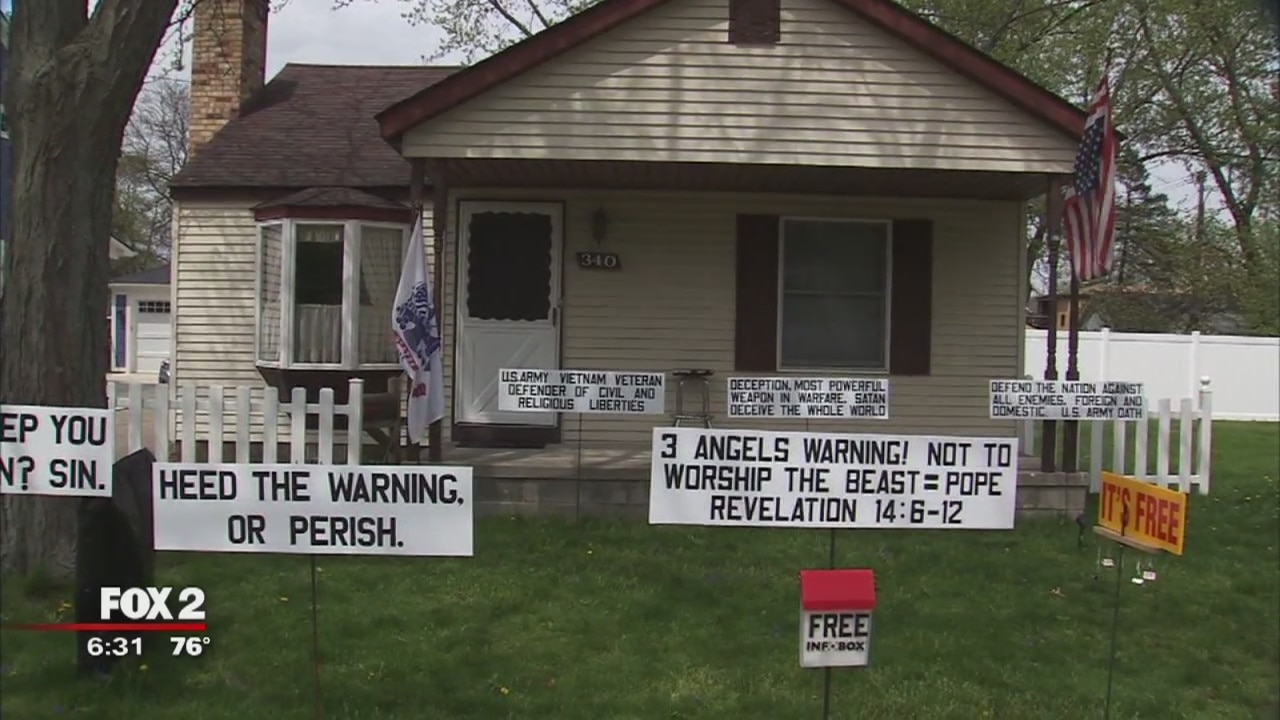 Religious signs in front of Plymouth house rankle neighbors