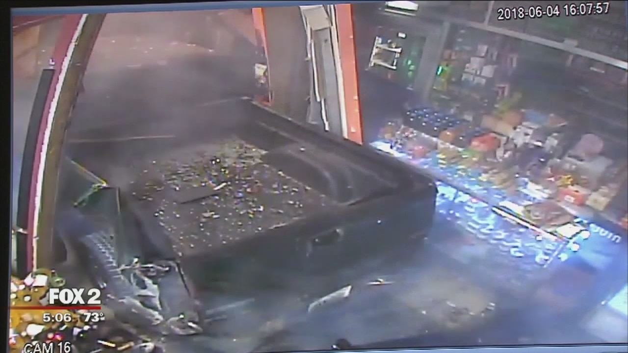 VIDEO: Thieves smash truck into, rob Detroit liquor store