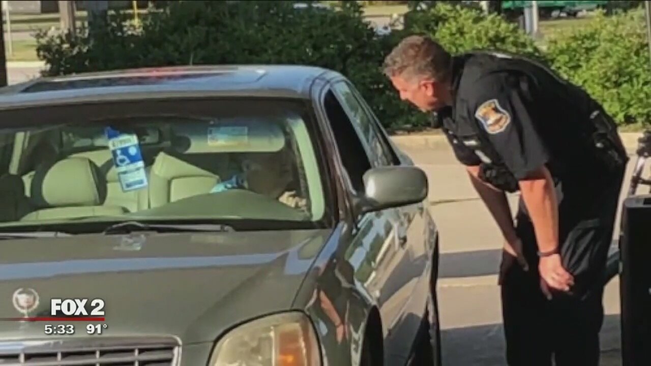 Michigan cop pays for and pumps gas for elderly woman, viral photo shows
