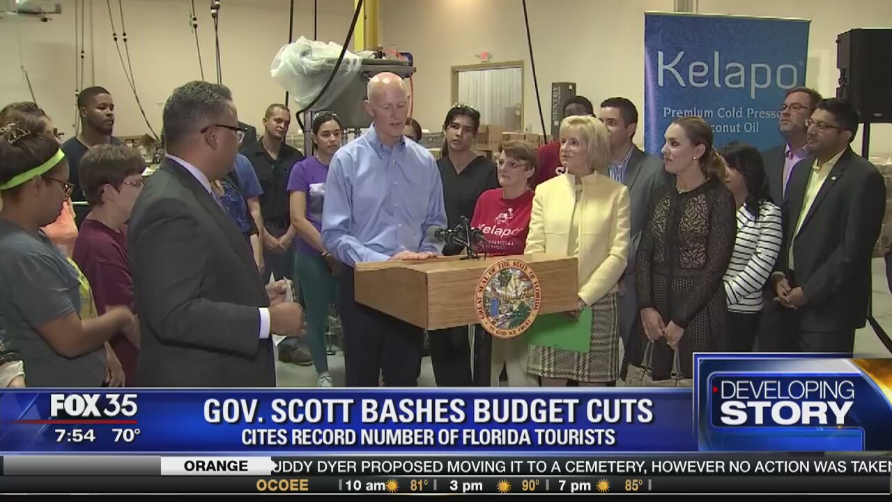 Gov. Scott bashes budget cuts, as record number of tourists visit Florida