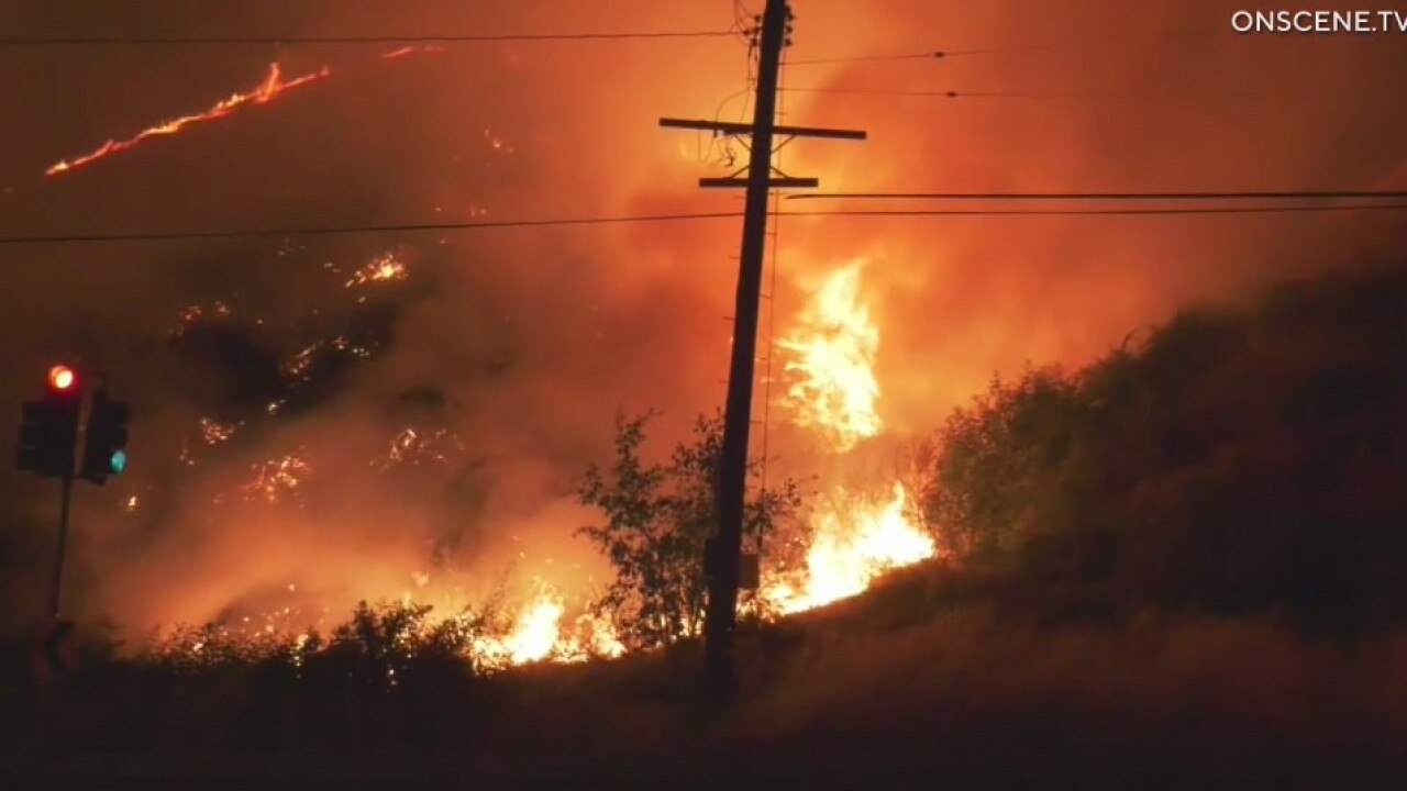 Firefighters battle brush fire in Sepulveda Pass