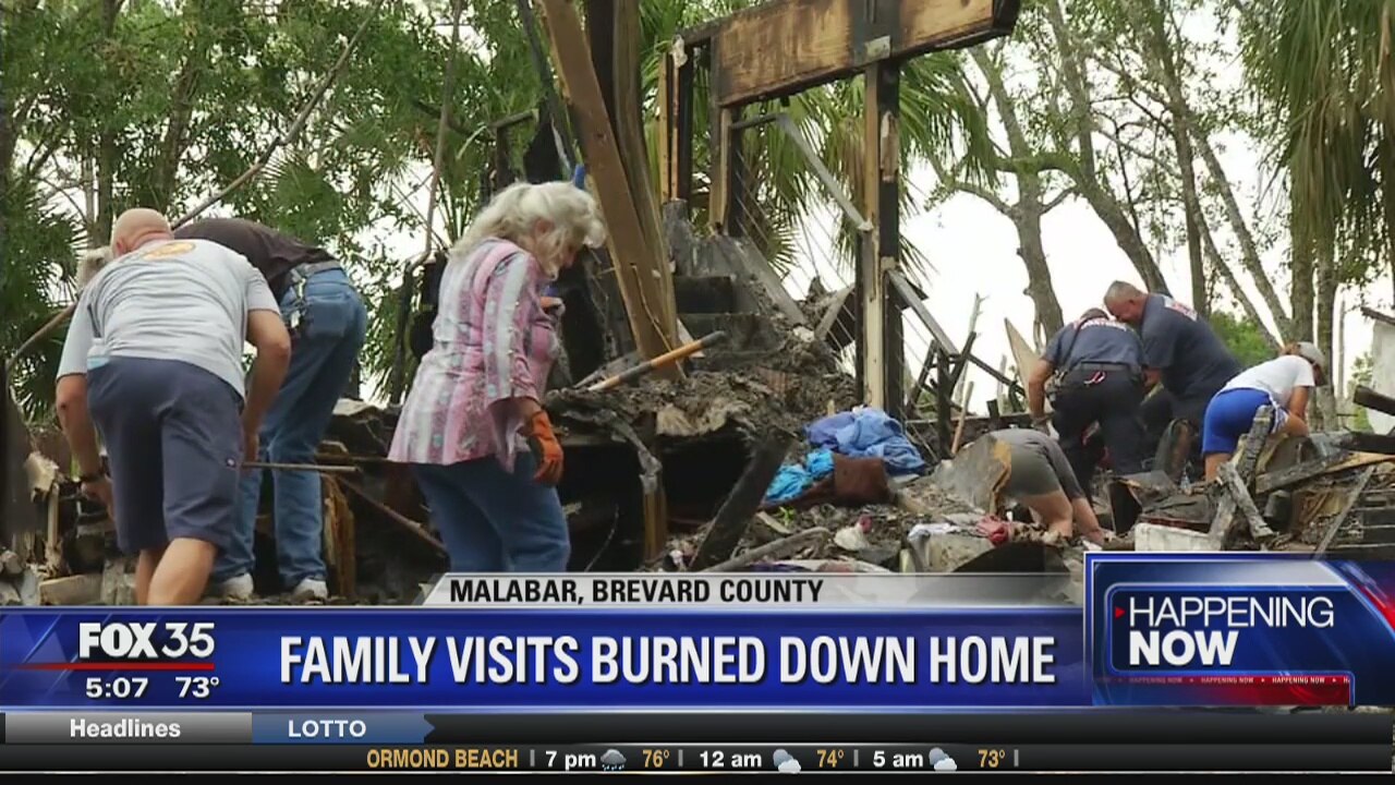 Family members search burned Malabar home