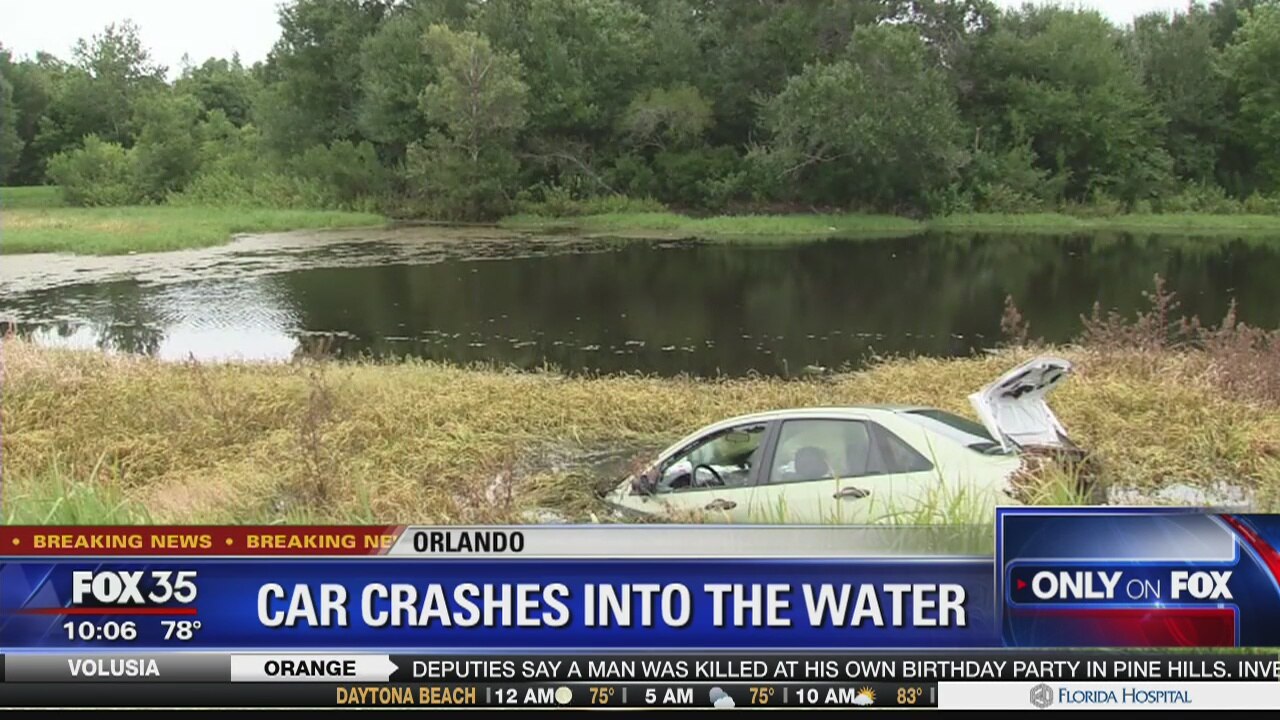 Car crashes into water behind Orlando home