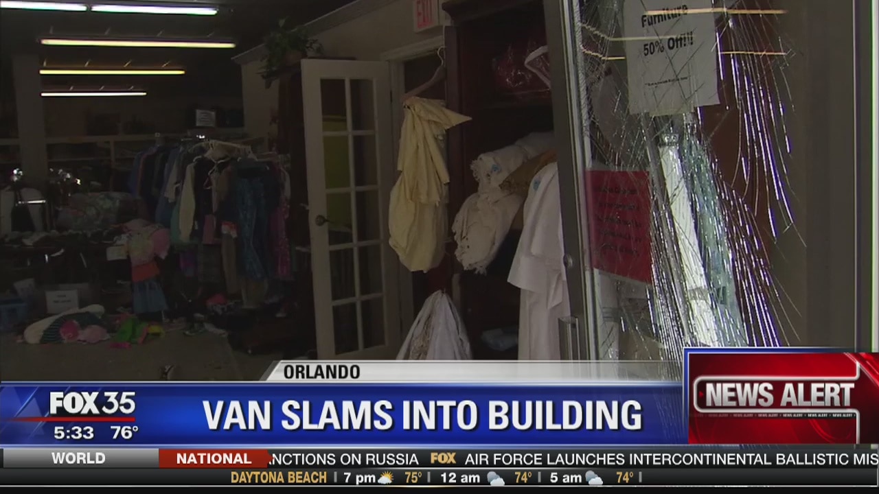 Van slams into Orlando building
