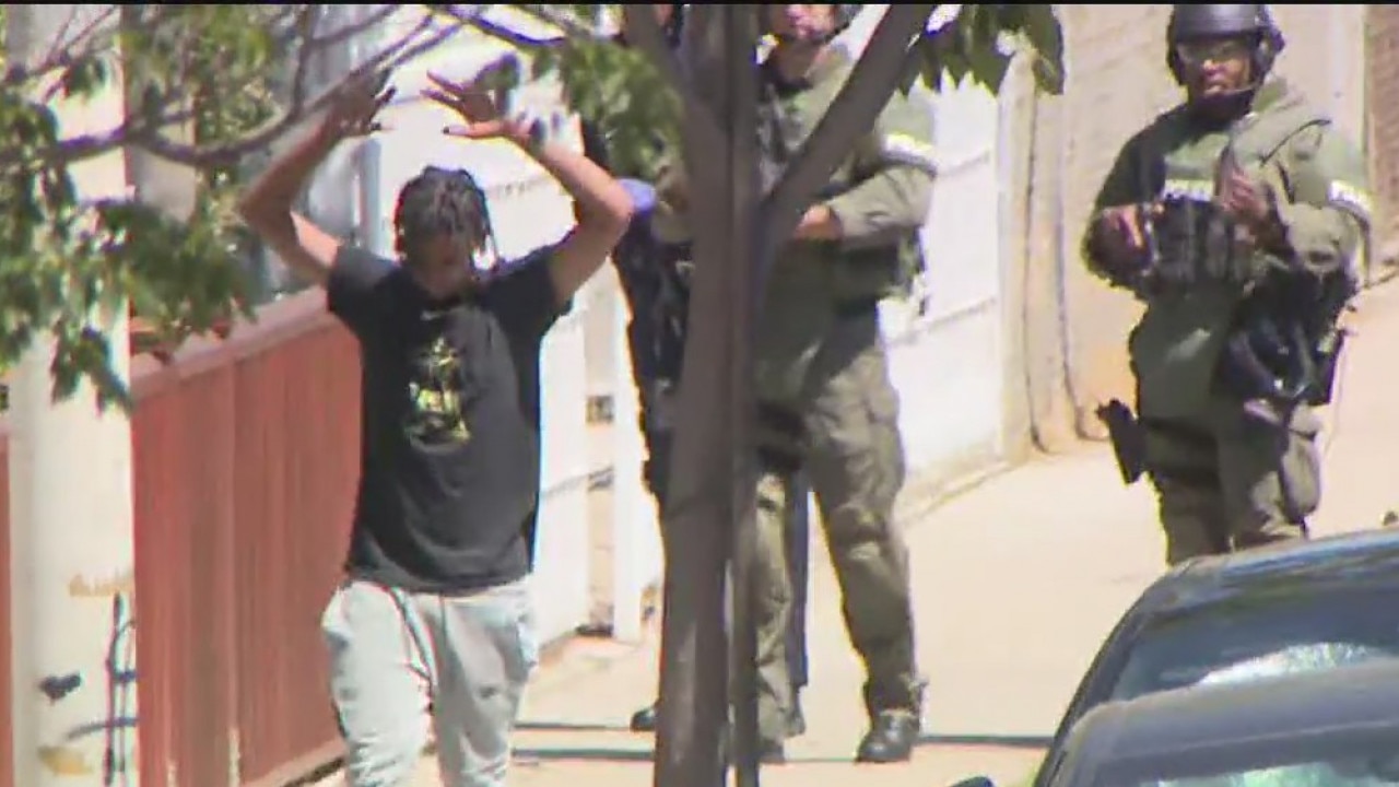 Robbery suspects surrender after standoff, police pursuit