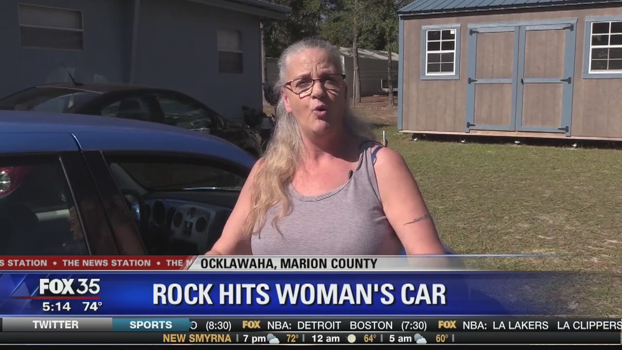 Rock hit woman's car