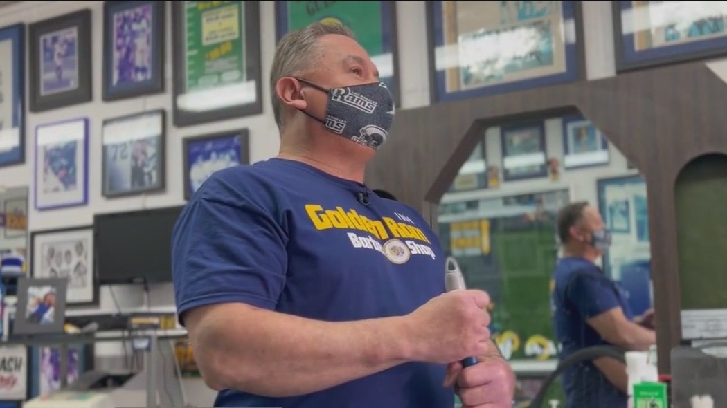 Barber shop owner shows off dedication as Rams fan
