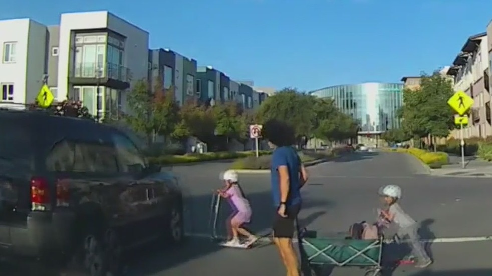 SUV narrowly misses little girl