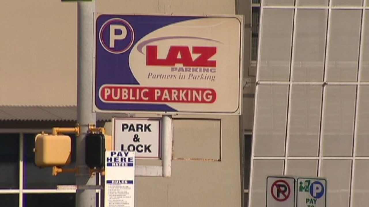 Two men, posing as parking lot attendants, arrested for theft