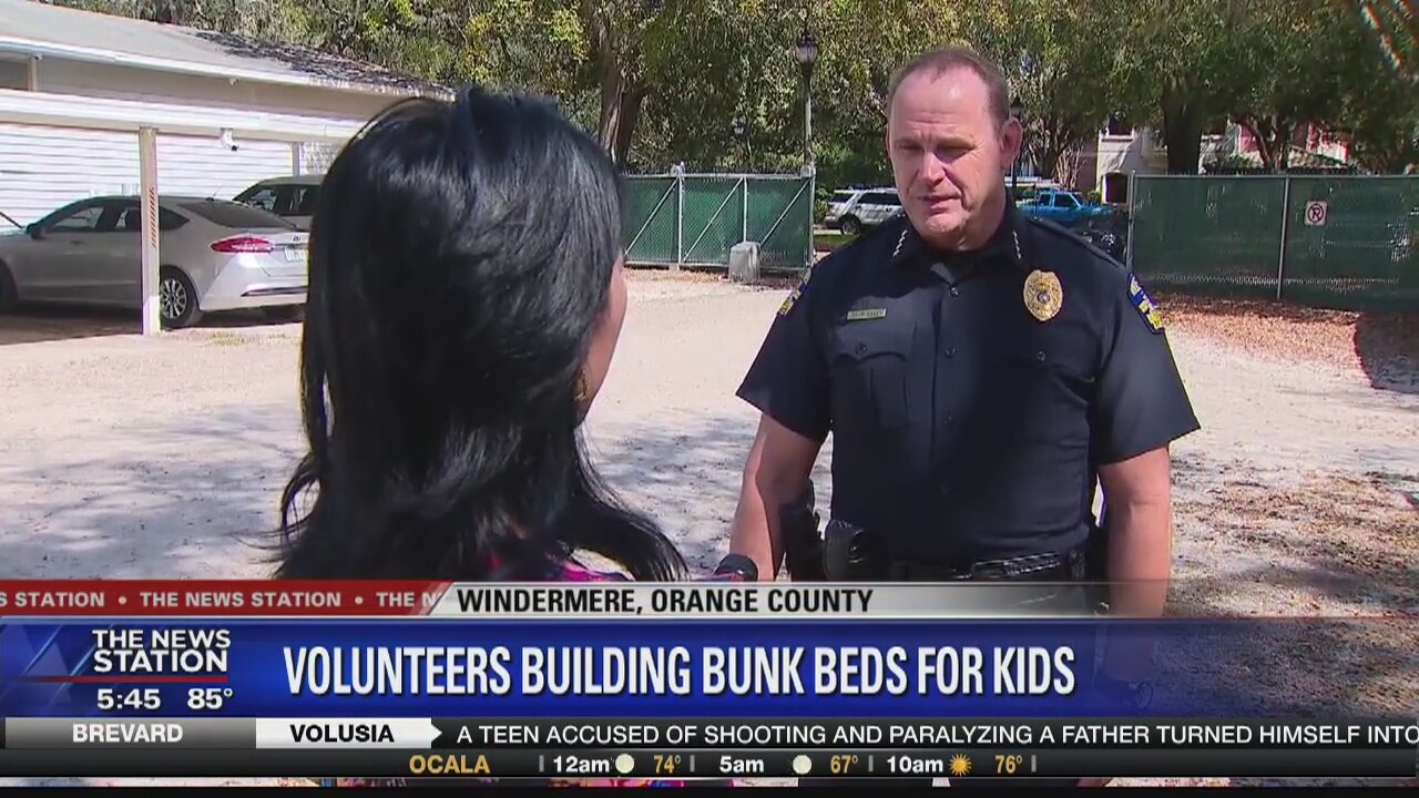 Volunteers building bunk beds for kids