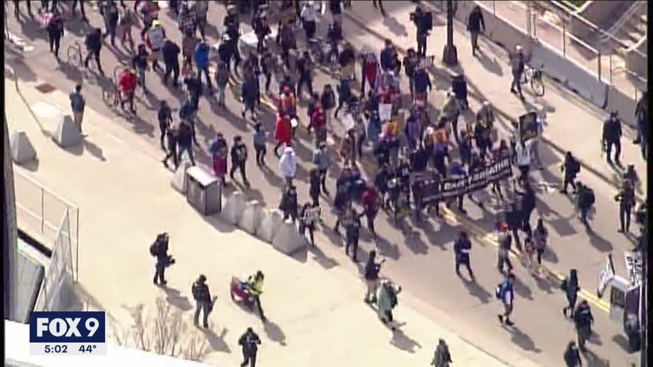 Demonstration leads marchers through the streets of downtown Minneapolis ahead of Chauvin trial