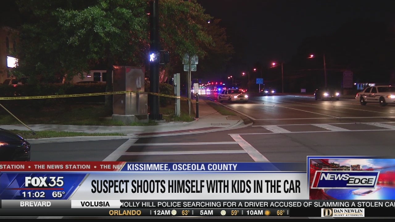Suspect shoots himself with kids in car