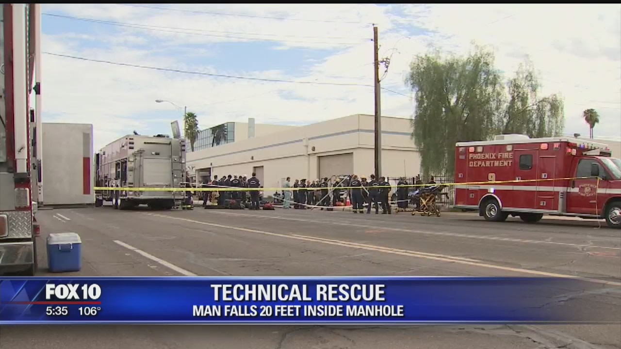 Phoenix firefighters working to rescue hurt man in manhole
