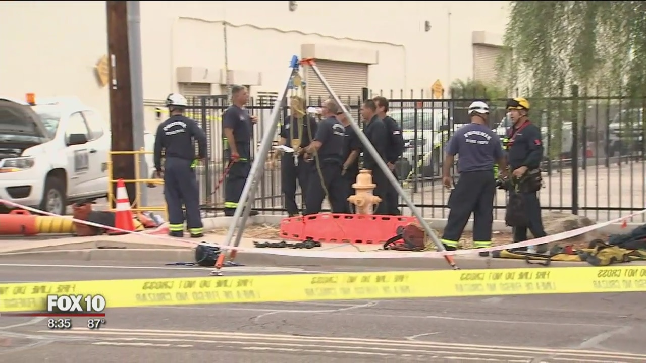 Phoenix firefighters working to rescue hurt man in manhole