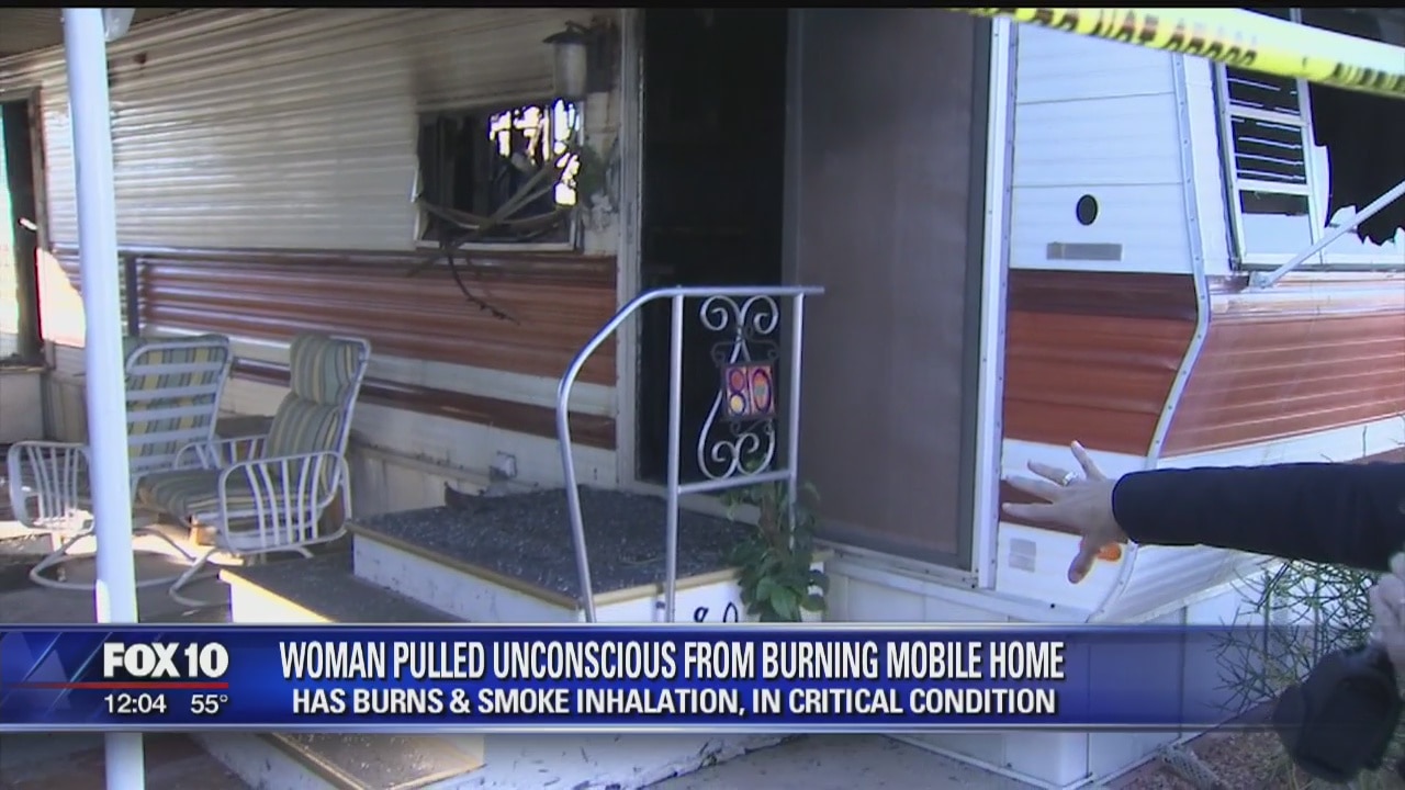 Woman pulled from burning mobile home