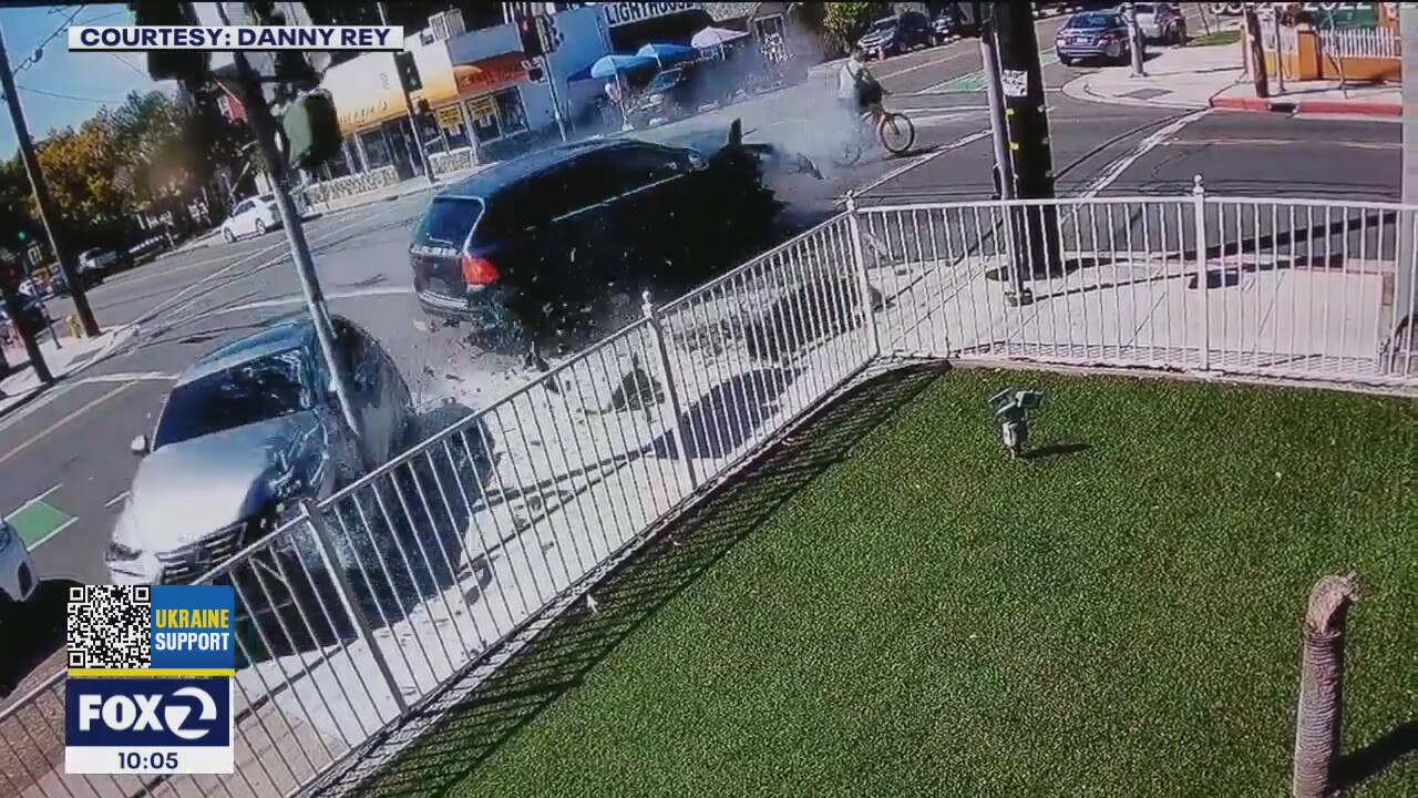 Cars collide, nearly hitting bike rider in dramatic video