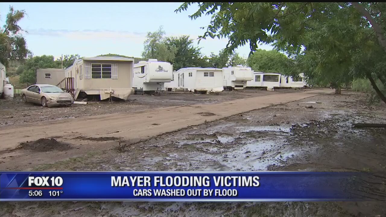Mayer residents pick up the pieces after flash flood