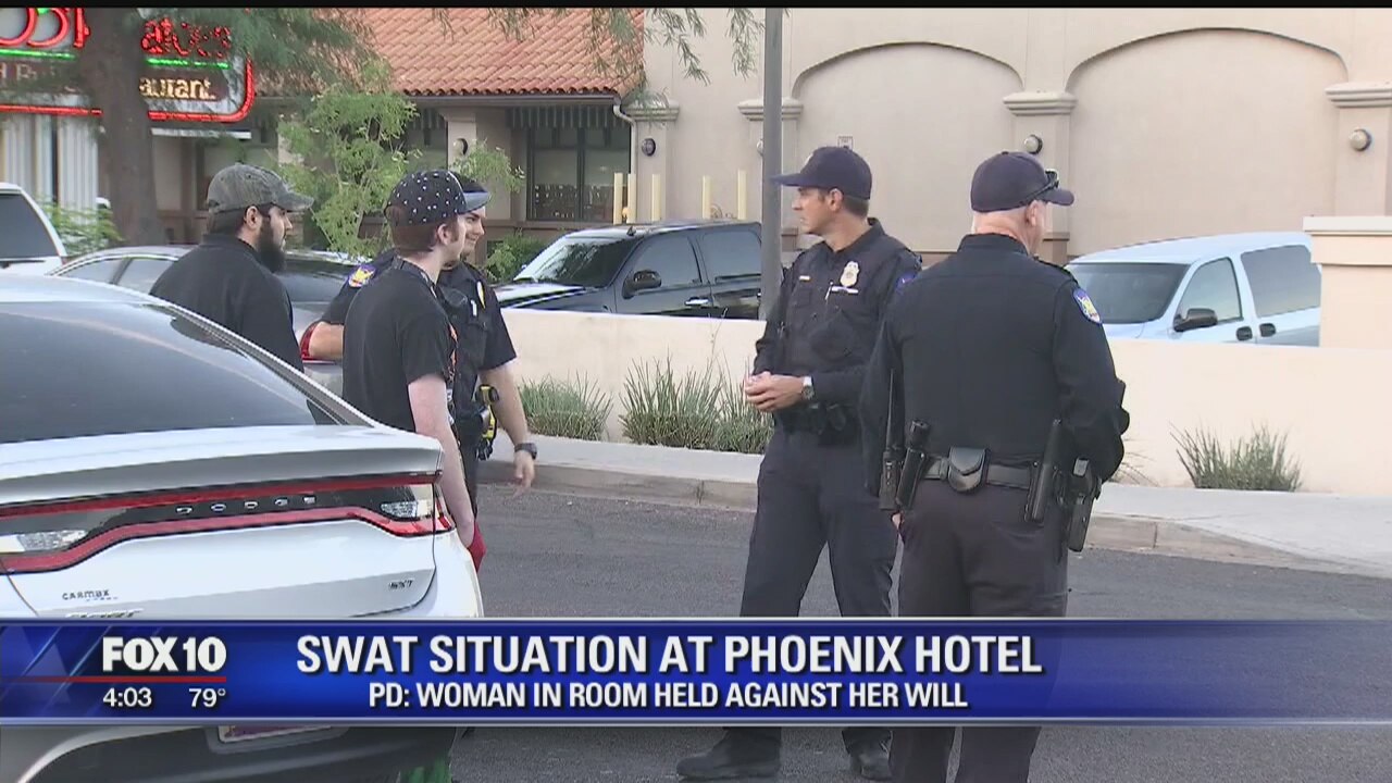 Police: Armed man barricades self, woman inside Phoenix hotel