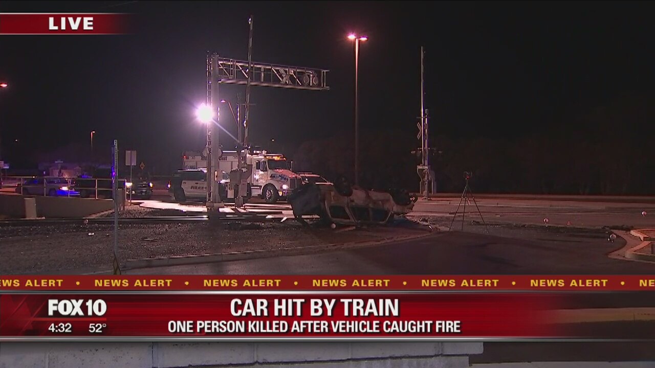 Gilbert police: 1 dead after car crashes into moving train