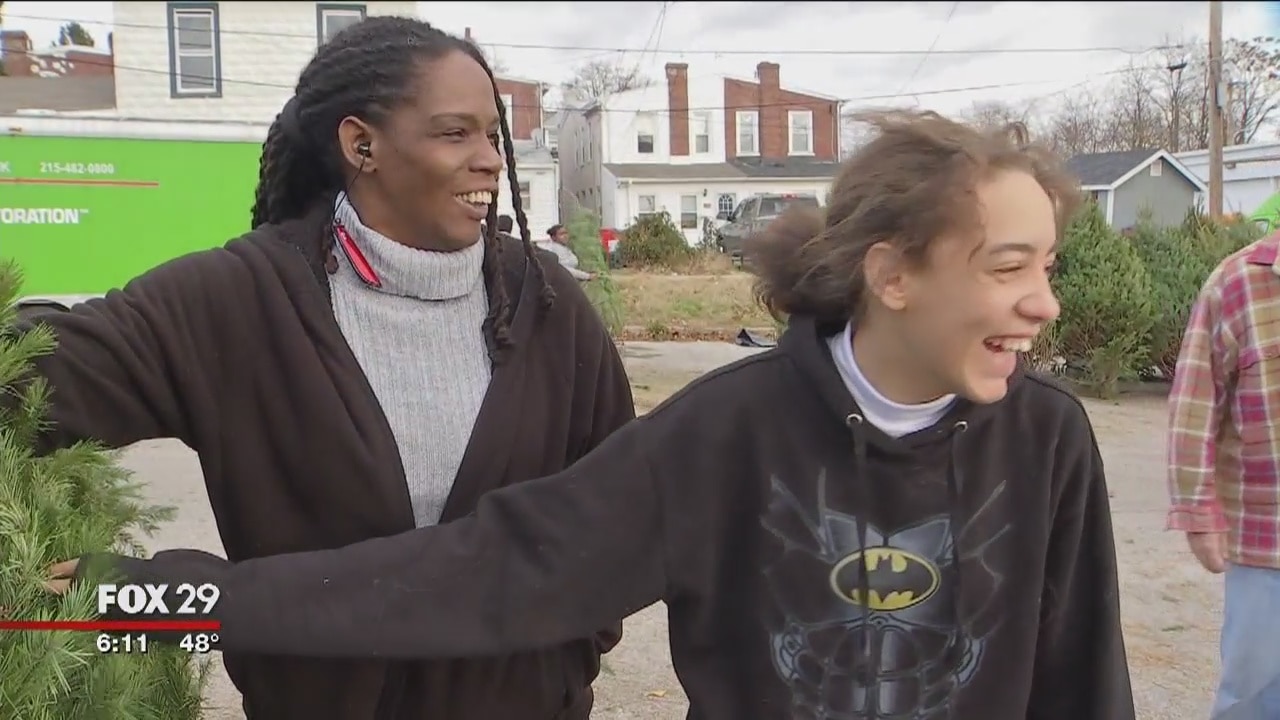 Local business owner and Norristown PD donate free Christmas trees to families in need