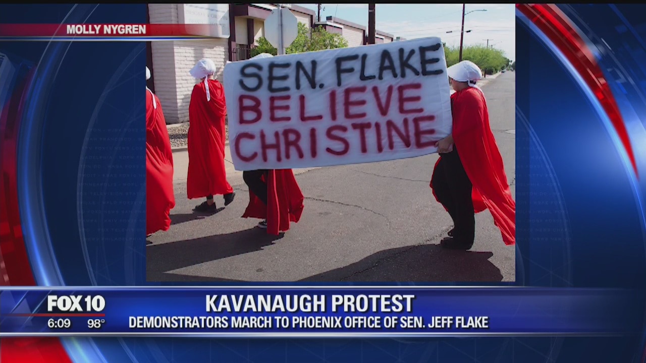 Demonstrators march to Flake's Phoenix office to protest Kavanaugh