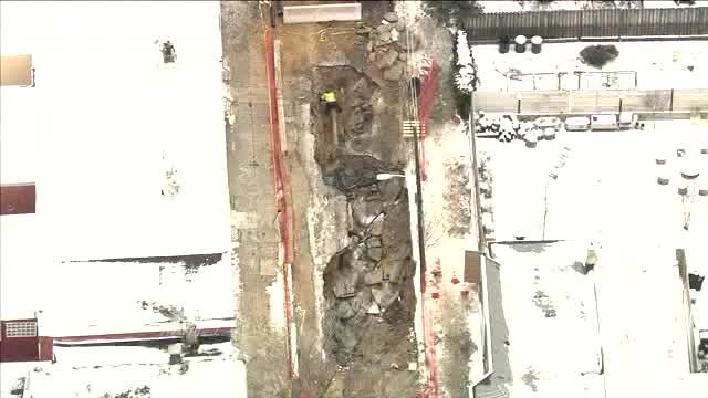 Working in freezing conditions after water main break causes street collapse