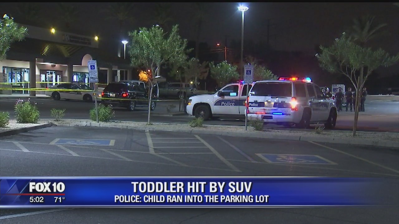 Police: 3-year-old stuck by car at south Phoenix parking lot
