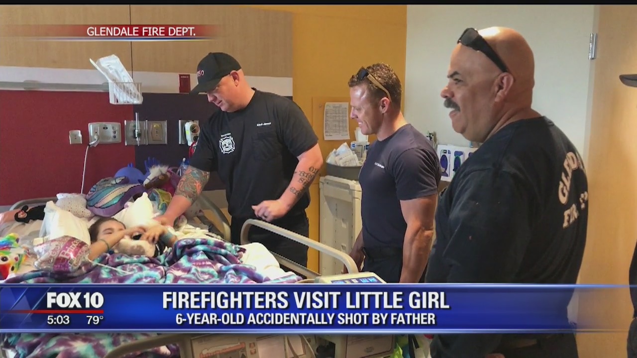 Firefighters visit girl who was shot by her father accidentally