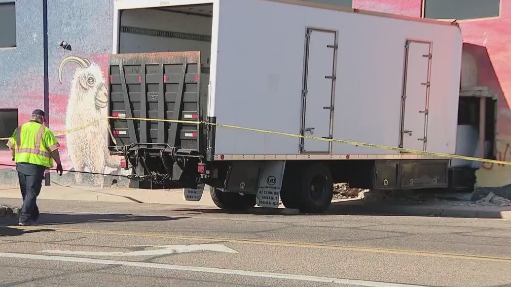 Truck crashes into central Phoenix building; driver OK