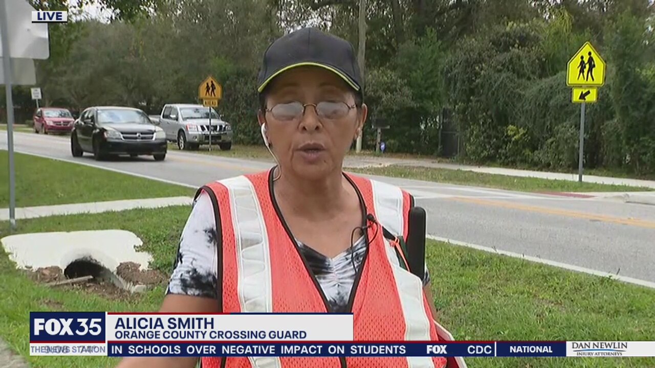 Crossing guard is being recognized for talking to each student and parent every day
