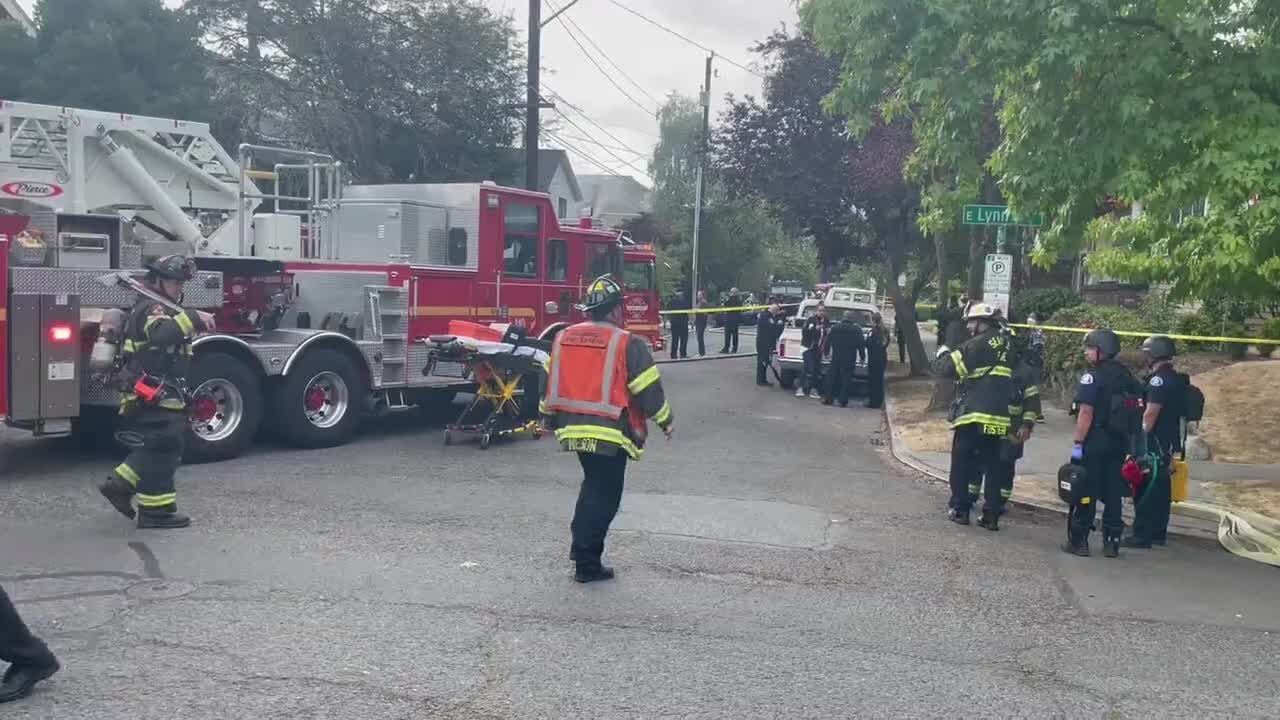 Man with knife inside burning Seattle home; another injured person may be inside