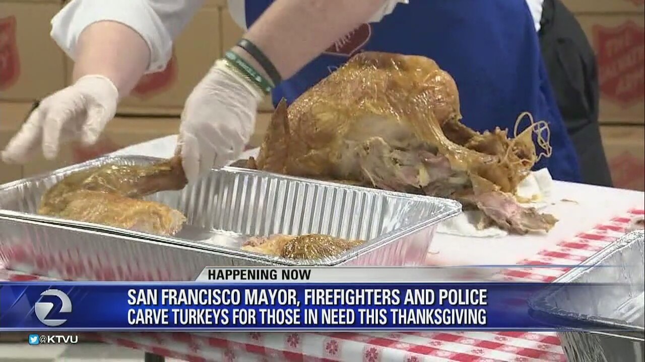 San Francisco chiefs of police and fire, and mayor carve Thanksgiving turkey
