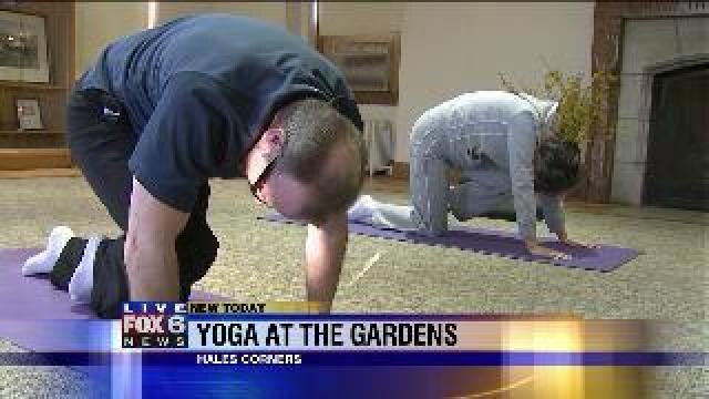 Laura learns some Yoga positions