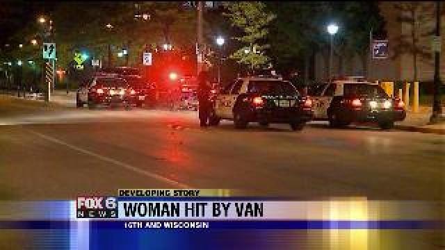 Woman struck by van
