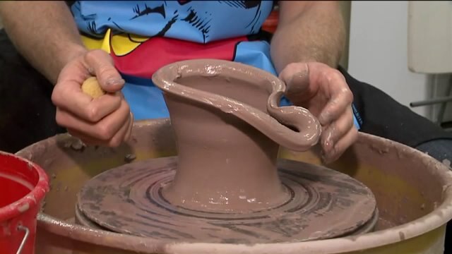 Calr has a blast working with clay at Twice Baked Pottery
