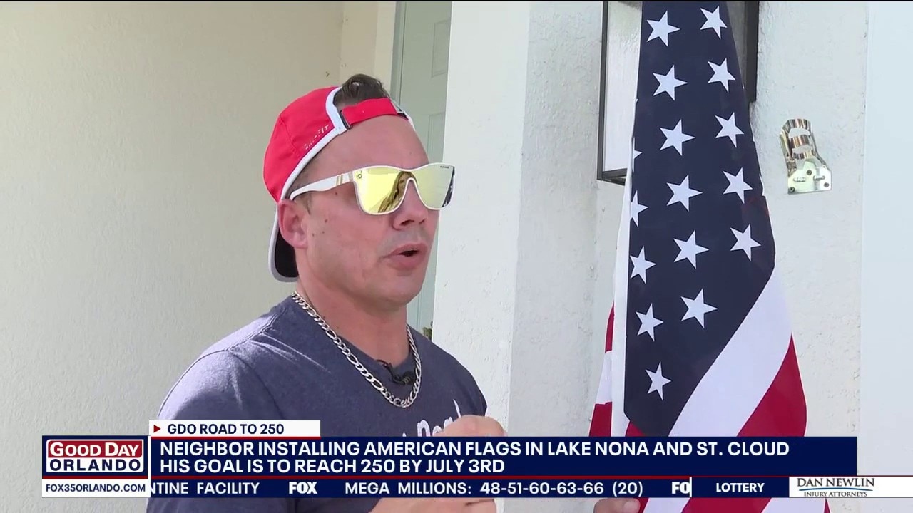 Florida man helping install American flags