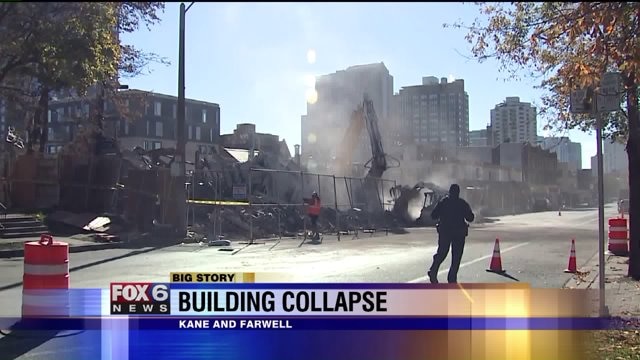 Building collapses during demolition, sending debris into street: "The whole building shook"