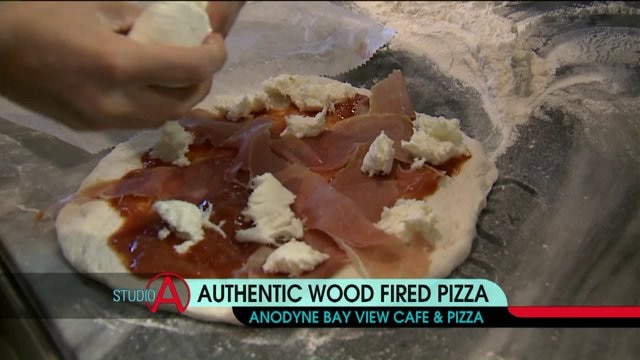 Picking toppings for a pizza at Bay View Cafe & Pizza