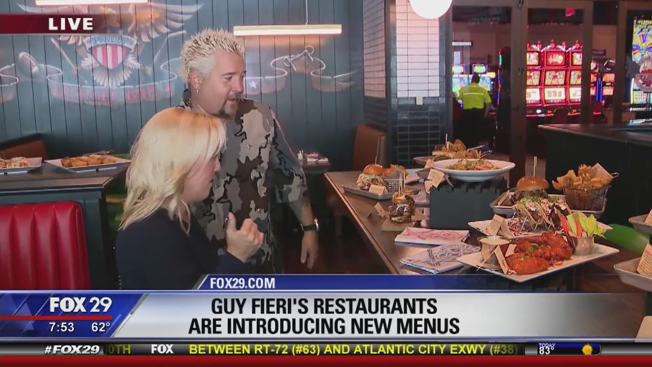 Jenn Fred is hanging with Guy Fieri as he introduces new menus!